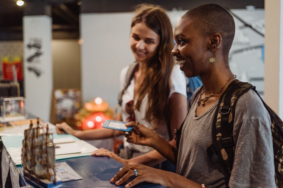 A regular customer smiling at the booking counter